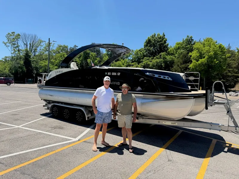 Customers with their newly purchased boat
